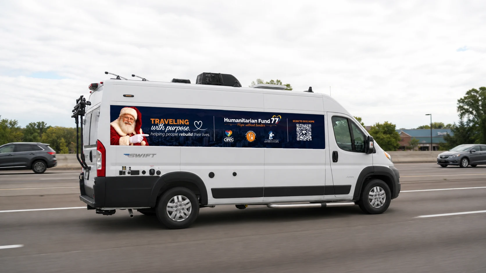 The Hope Without Borders Santa RV traveling in daytime traffic